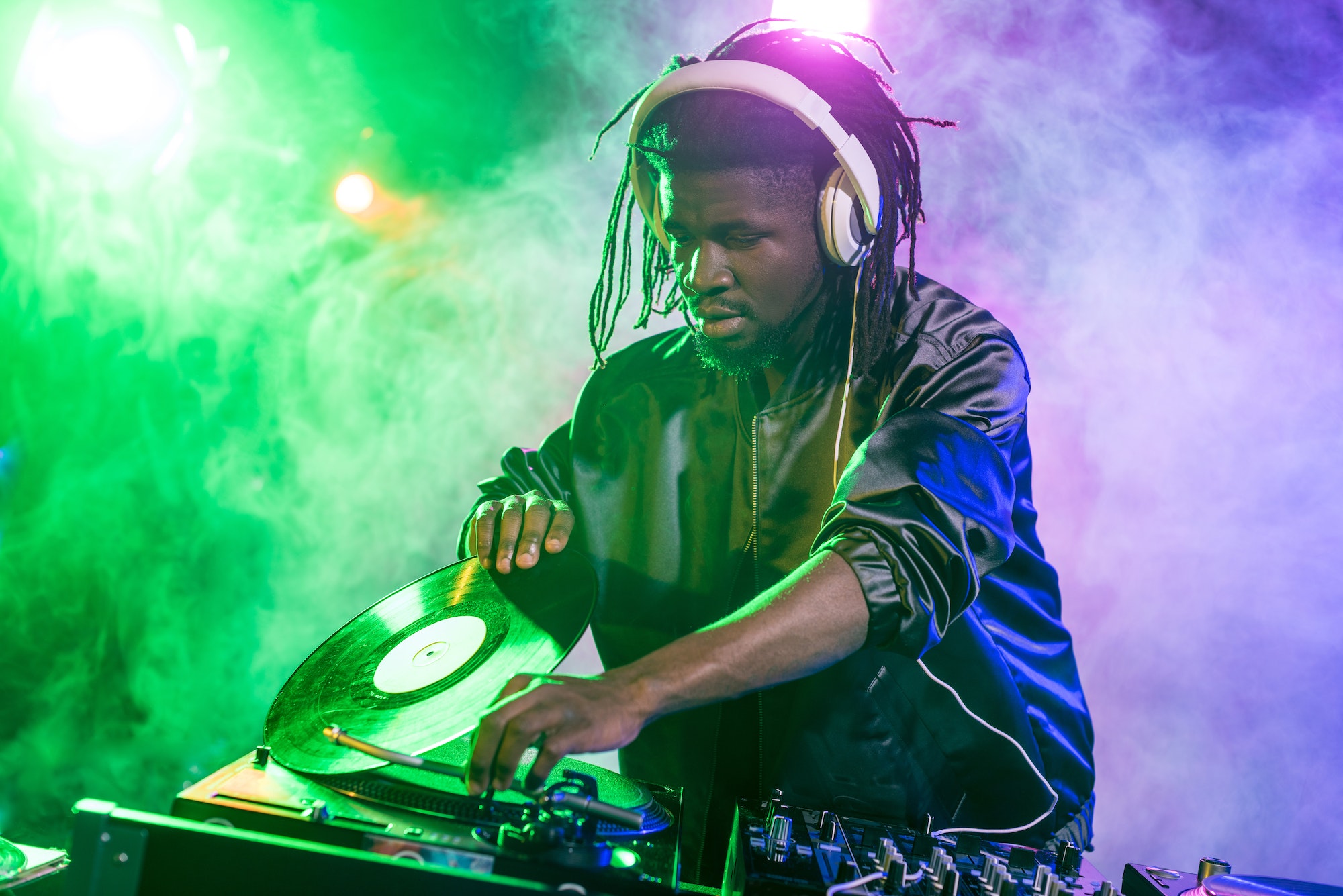 https://revolution.edu.za/wp-content/uploads/2022/12/professional-african-american-dj-in-headphones-with-sound-mixer-in-nightclub.jpg
