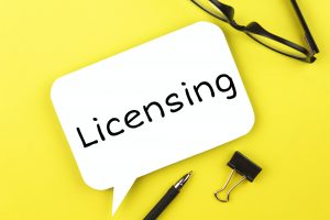 White paper speech bubble with inscription licensing